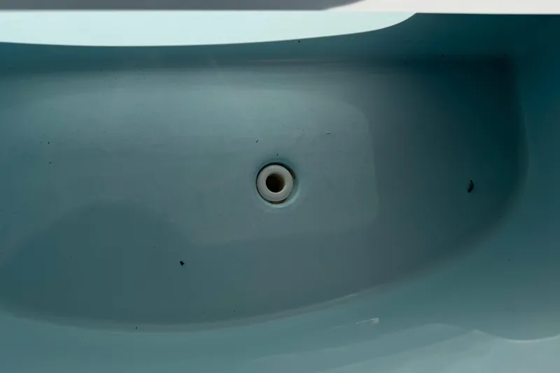 Slide: The Image of Drain plug of 2016 Sportsman Heritage 231 Center Console boat. - 51