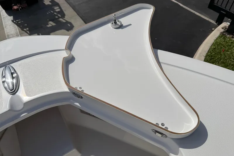 Slide: The Image of 2016 Sportsman Heritage 231 Center Console boat detail, featuring a sleek white deck design. - 53