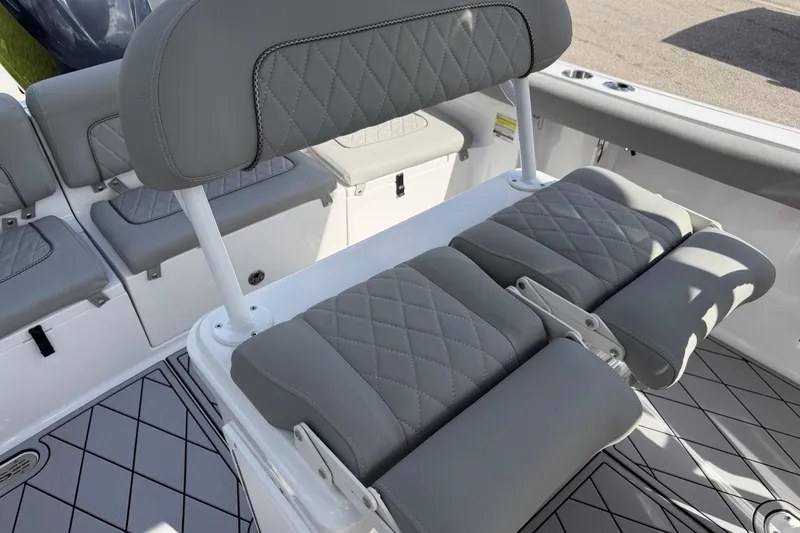 Slide: The Image of 2016 Sportsman Heritage 231 Center Console boat with gray cushioned seating. - 54