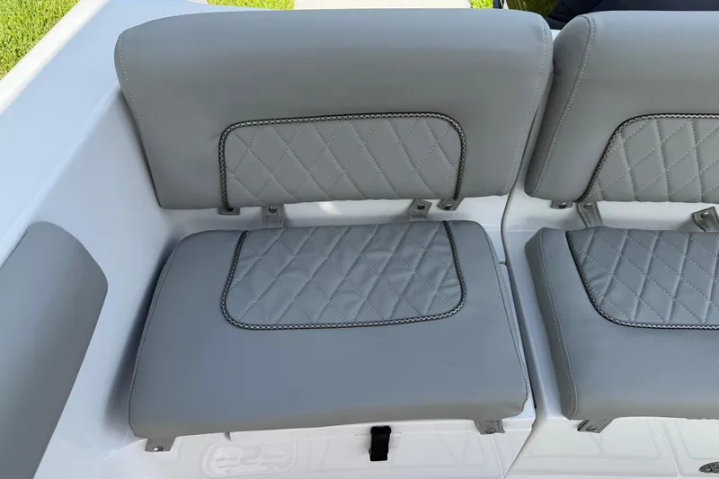 Slide: The Image of Gray cushioned seats on 2016 Sportsman Heritage 231 Center Console boat. - 56