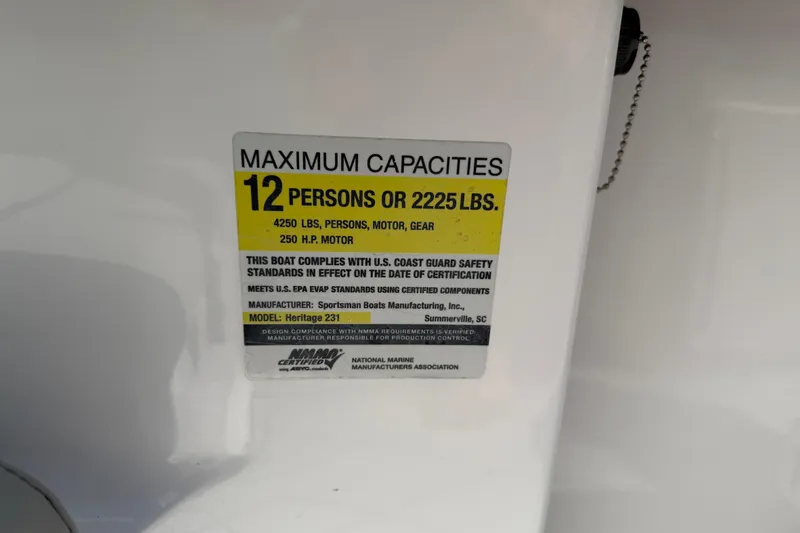 Slide: The Image of Capacity label on 2016 Sportsman Heritage 231 Center Console boat, max 12 persons or 2225 lbs. - 59