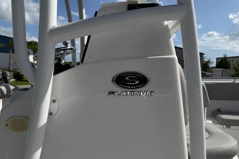 Slide: The Image of 2016 Sportsman Heritage 231 Center Console boat, featuring Platinum emblem and sleek design. - 6