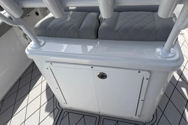 Slide: The Image of 2016 Sportsman Heritage 231 Center Console seating and storage area with quilted cushions. - 60