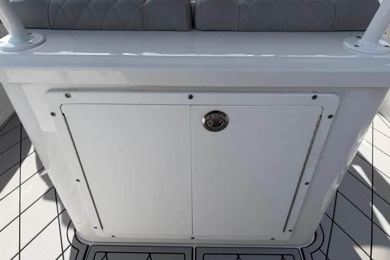 Slide: The Image of 2016 Sportsman Heritage 231 Center Console storage compartment with cushioned seating. - 61