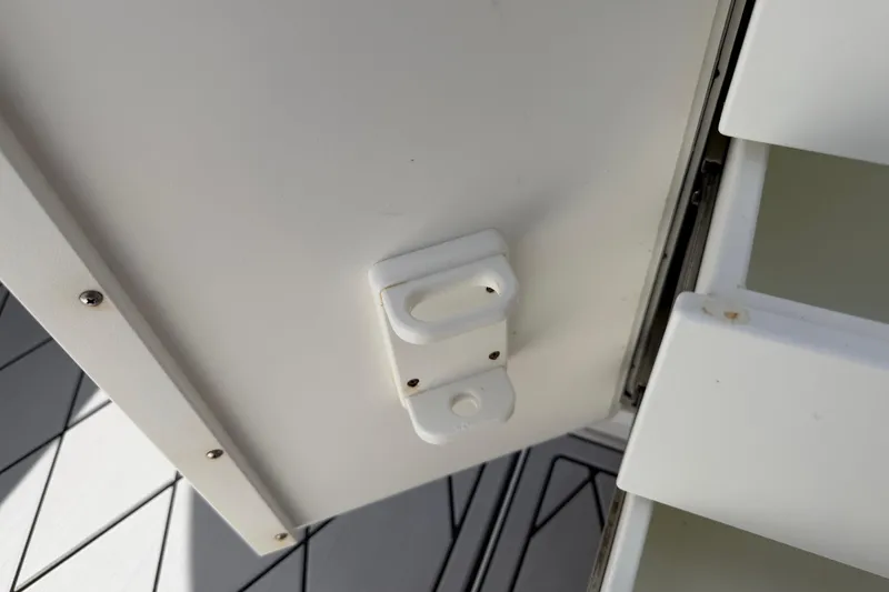 Slide: The Image of Cabinet latch on 2016 Sportsman Heritage 231 Center Console boat. - 63
