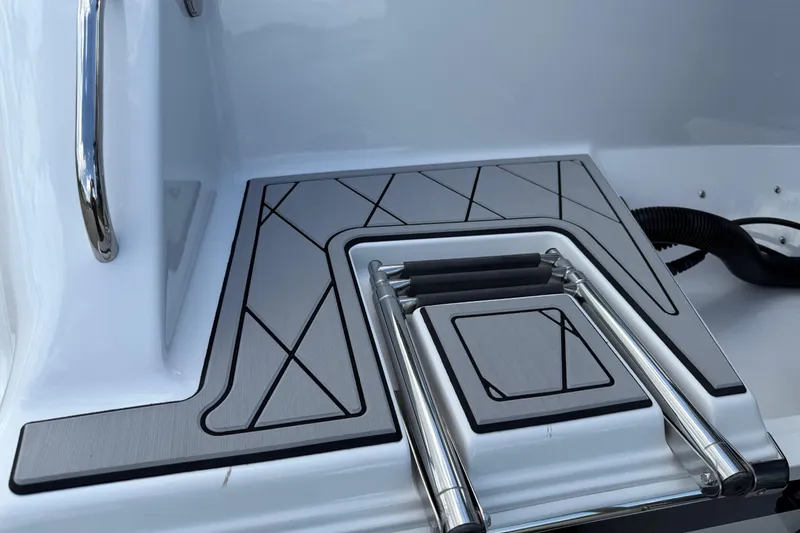 Slide: The Image of 2016 Sportsman Heritage 231 Center Console boat ladder and deck detail. - 7