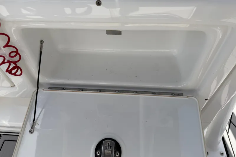 Slide: The Image of Storage compartment of a 2016 Sportsman Heritage 231 Center Console boat. - 70