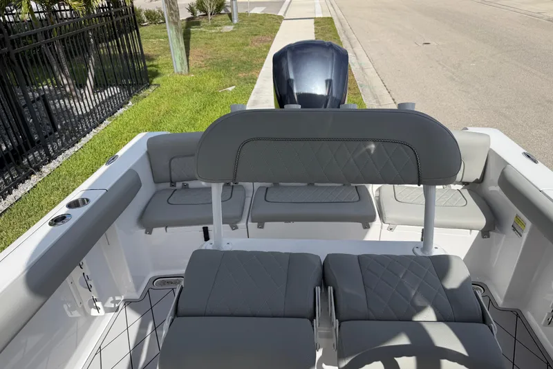 Slide: The Image of 2016 Sportsman Heritage 231 Center Console boat interior with gray seating and console view. - 71