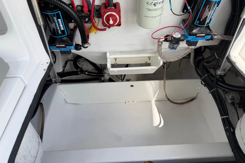 Slide: The Image of 2016 Sportsman Heritage 231 Center Console boat wiring and battery compartment. - 74