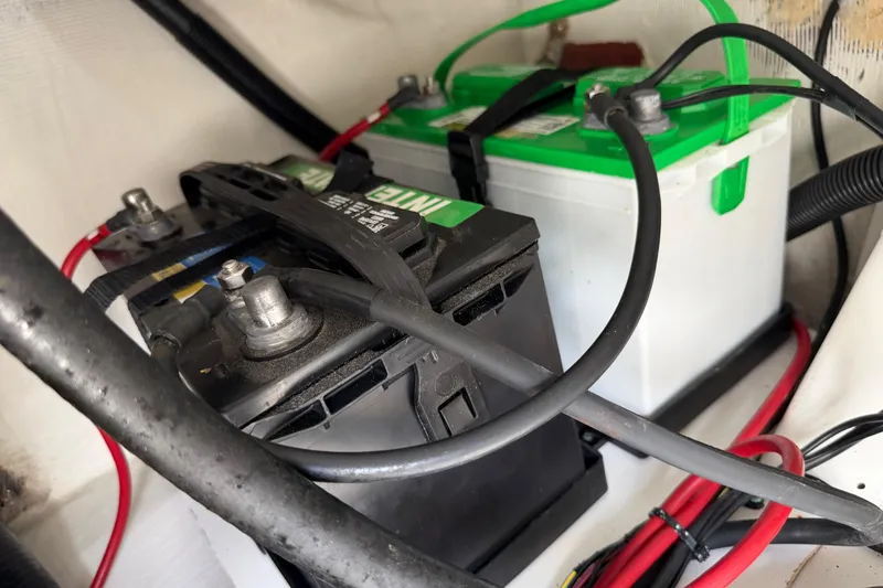 Slide: The Image of Batteries and wiring inside a 2016 Sportsman Heritage 231 Center Console boat. - 79