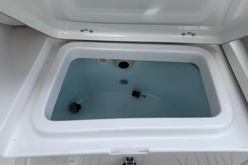 Slide: The Image of Livewell compartment in 2016 Sportsman Heritage 231 Center Console boat. - 80