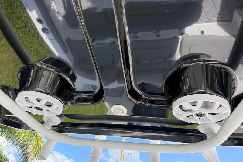 Slide: The Image of 2016 Sportsman Heritage 231 Center Console speakers on boat's T-top. - 91