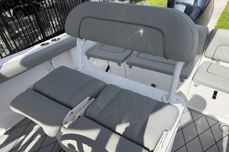 Slide: The Image of 2016 Sportsman Heritage 231 Center Console boat with gray cushioned seating. - 92