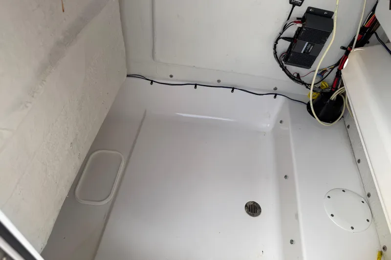 Slide: The Image of 2016 Sportsman Heritage 231 Center Console interior with wiring and drainage system. - 97