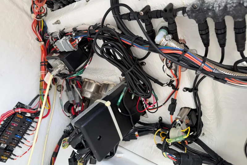 Slide: The Image of Electrical wiring and components inside a 2016 Sportsman Heritage 231 Center Console boat. - 99