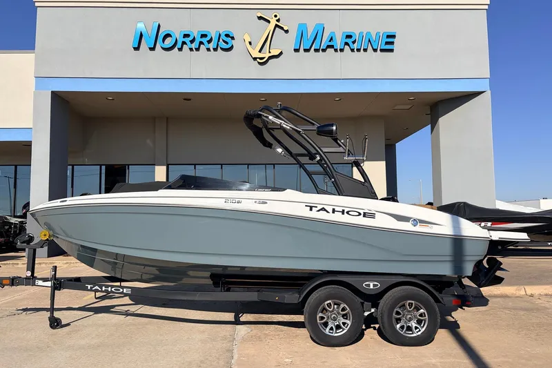 The Image of 2025 Tahoe 210 Si boat on trailer at Norris Marine dealership. - 1