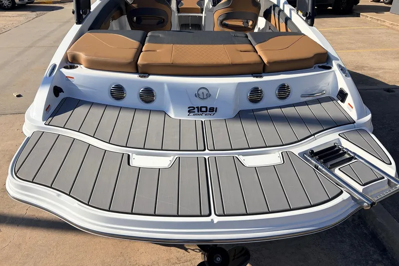 Slide: The Image of 2025 Tahoe 210 Si boat with sleek deck design and comfortable seating. - 10
