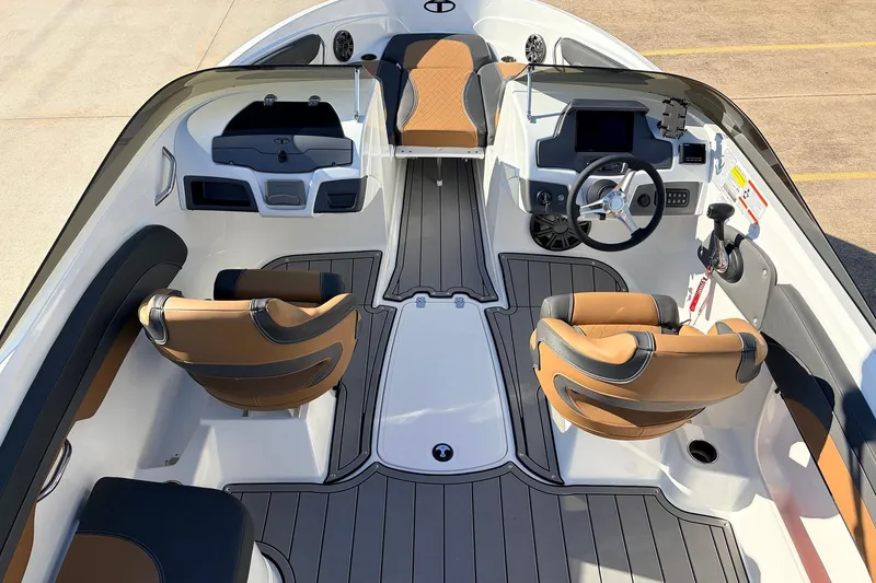 Slide: The Image of 2025 Tahoe 210 Si boat interior with modern seating and sleek dashboard design. - 12