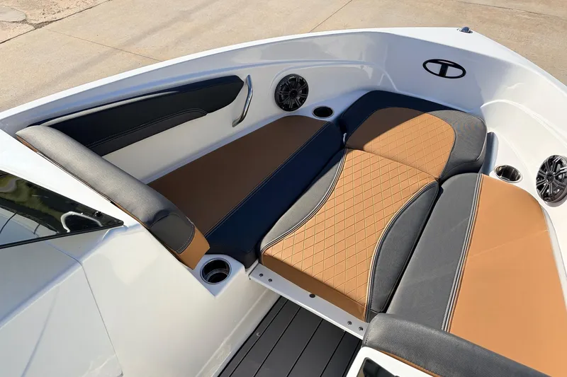 Slide: The Image of Luxurious seating in the 2025 Tahoe 210 Si boat, featuring stylish brown and black upholstery. - 14