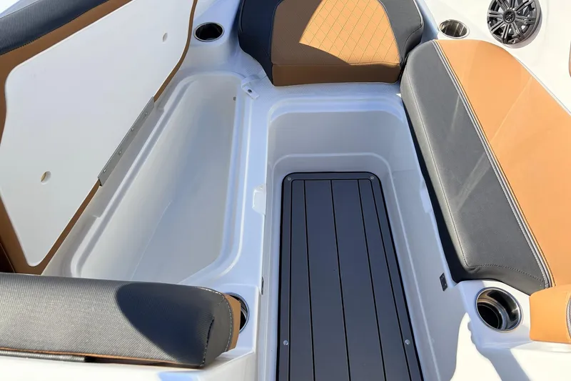 Slide: The Image of Interior seating and storage of 2025 Tahoe 210 Si boat, featuring sleek design and cup holders. - 19