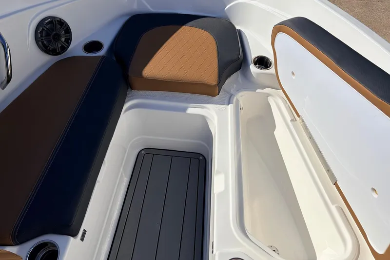 Slide: The Image of Interior seating and storage of 2025 Tahoe 210 Si boat, featuring brown and black upholstery. - 20