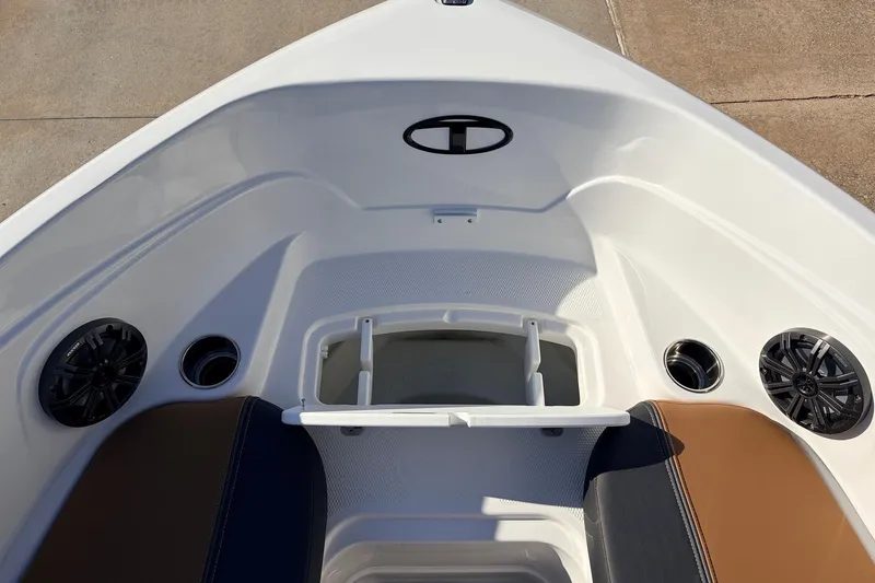 Slide: The Image of 2025 Tahoe 210 Si boat interior with speakers and seating. - 22