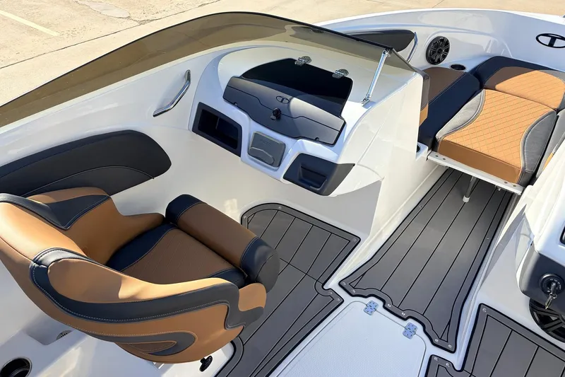 Slide: The Image of 2025 Tahoe 210 Si boat interior with modern seating and sleek dashboard design. - 24