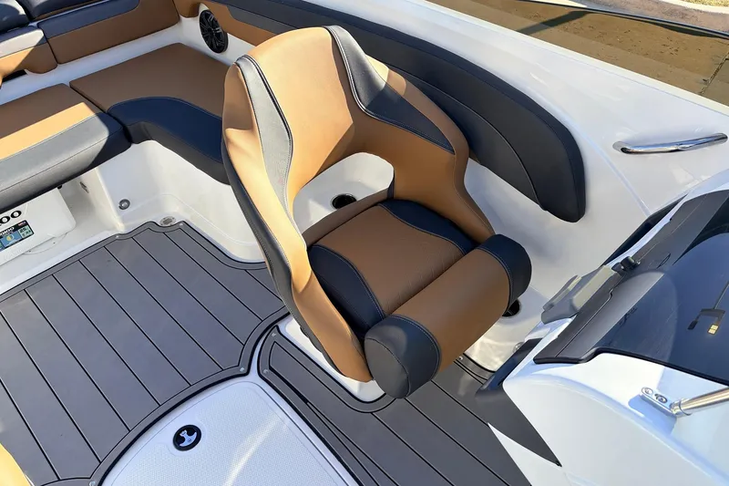 Slide: The Image of 2025 Tahoe 210 Si boat interior with tan and black seating, modern design. - 29