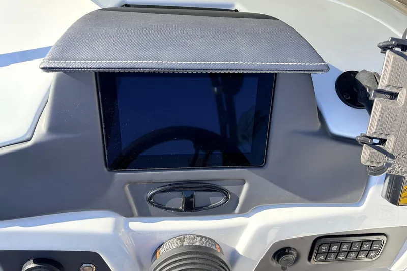 Slide: The Image of Dashboard of 2025 Tahoe 210 Si boat with touchscreen and controls. - 33