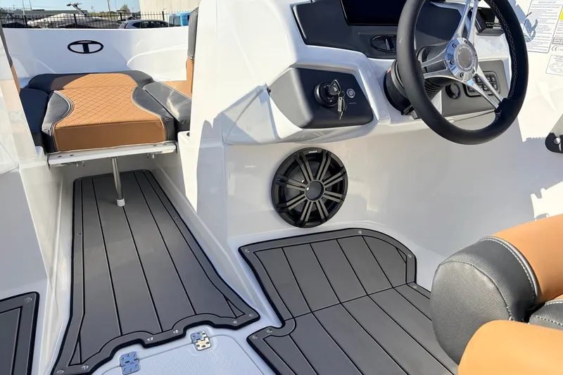 Slide: The Image of 2025 Tahoe 210 Si boat interior with sleek design, modern dashboard, and comfortable seating. - 39