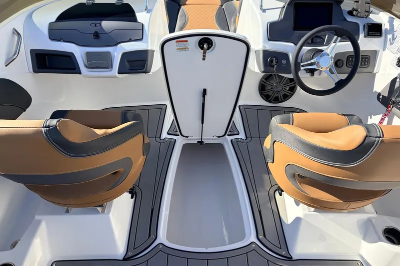 Slide: The Image of Interior of 2025 Tahoe 210 Si boat with modern dashboard and tan seating. - 40