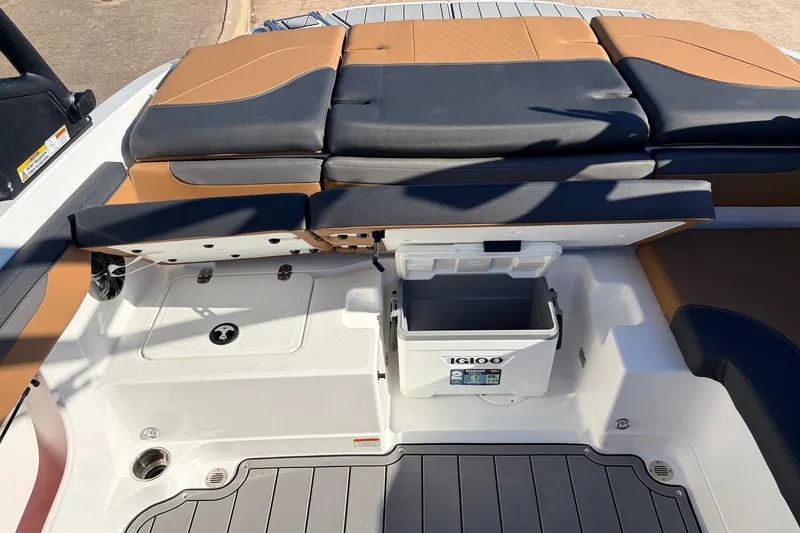 Slide: The Image of 2025 Tahoe 210 Si boat interior with seating and built-in cooler. - 46