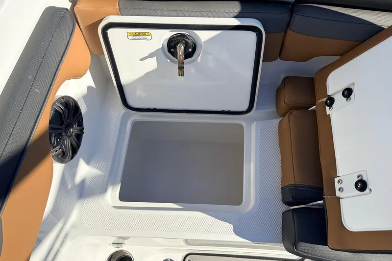 Slide: The Image of 2025 Tahoe 210 Si boat interior with storage compartment and seating. - 49
