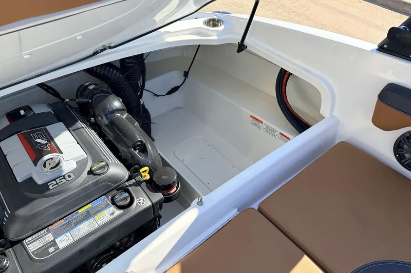 Slide: The Image of 2025 Tahoe 210 Si boat engine compartment with Mercury 250 engine. - 55
