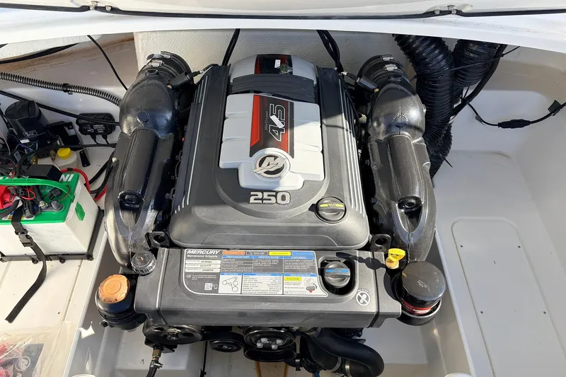 Slide: The Image of 2025 Tahoe 210 Si boat engine compartment with Mercury 250 horsepower motor. - 56