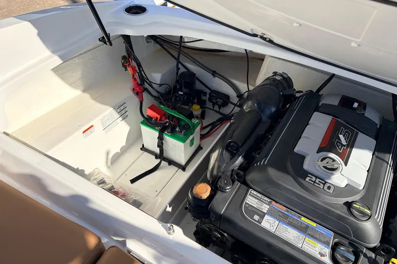 Slide: The Image of 2025 Tahoe 210 Si boat engine compartment with Mercury 4.5L 250 HP engine. - 57
