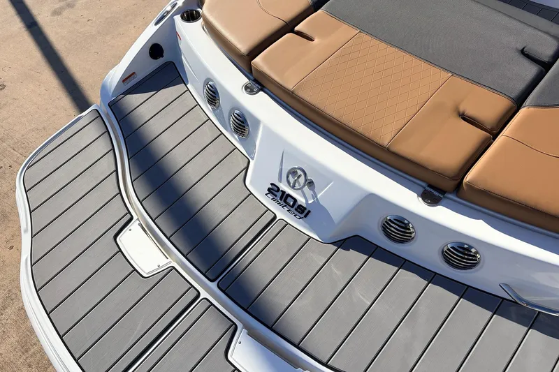 Slide: The Image of 2025 Tahoe 210 Si boat with cushioned seating and sleek deck design. - 58