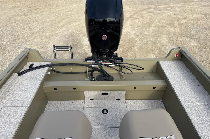 Slide: The Image of 2026 Lund 2075 Alaskan SS boat interior with motor and seating, showcasing spacious design. - 10