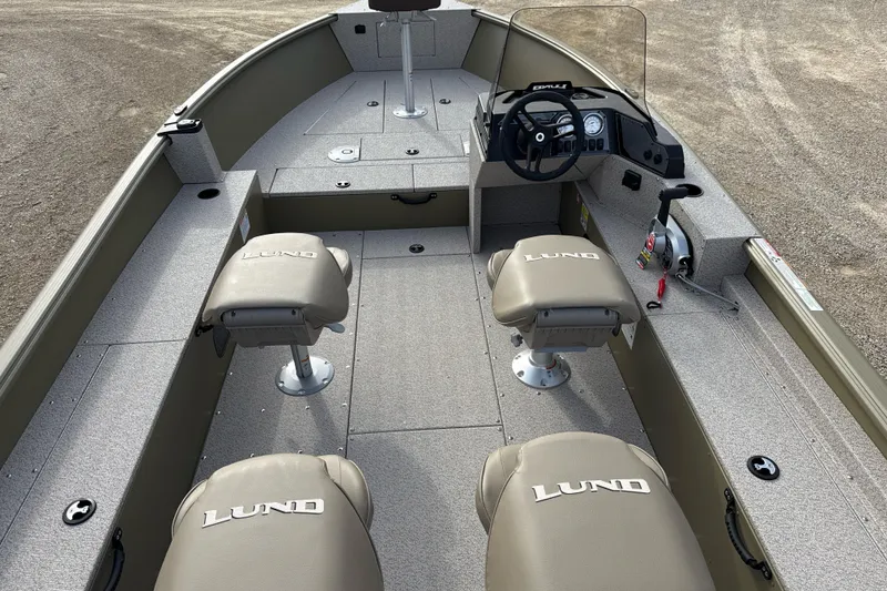 Slide: The Image of 2026 Lund 2075 Alaskan SS boat interior with seating and steering console. - 3