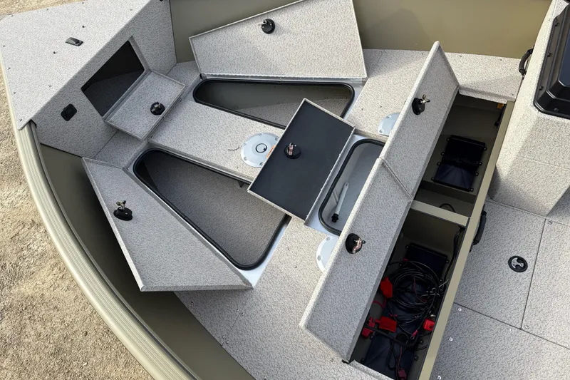 Slide: The Image of 2026 Lund 2075 Alaskan SS boat interior with open storage compartments. - 4