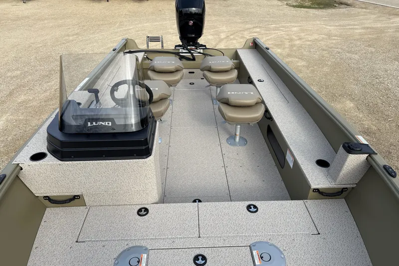 Slide: The Image of 2026 Lund 2075 Alaskan SS boat interior with seating and steering console. - 5