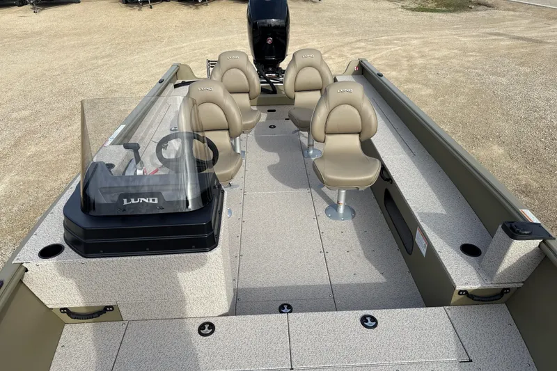 Slide: The Image of 2026 Lund 2075 Alaskan SS boat interior with seating and steering console. - 6