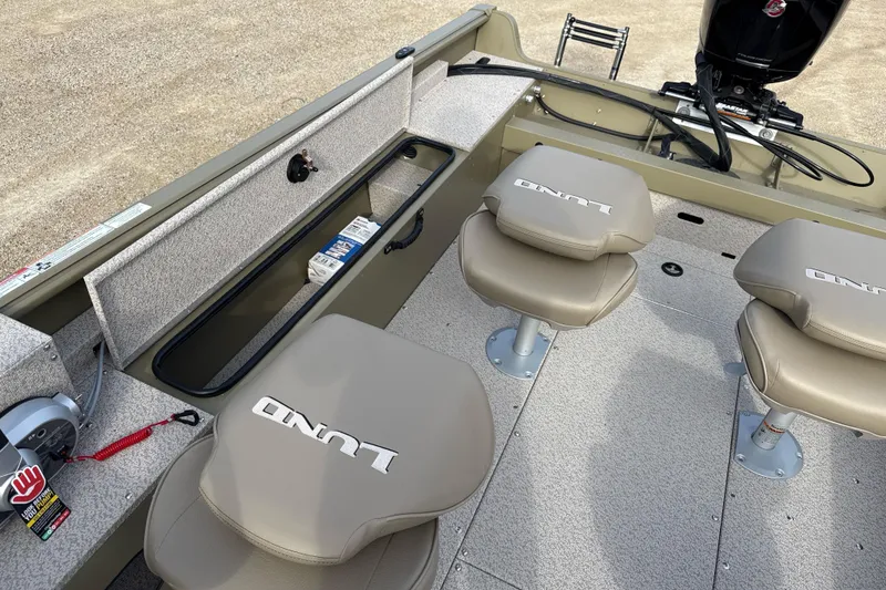 Slide: The Image of 2026 Lund 2075 Alaskan SS boat interior with seating and storage compartments. - 8