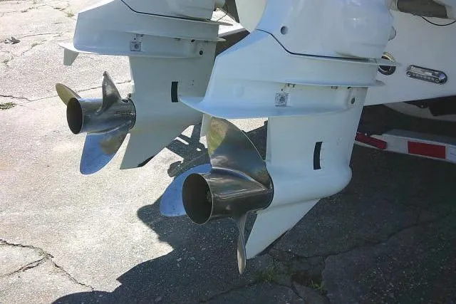 Slide: The Image of Twin outboard motors on a 2022 Sea Pro 259 Center Console boat. - 14