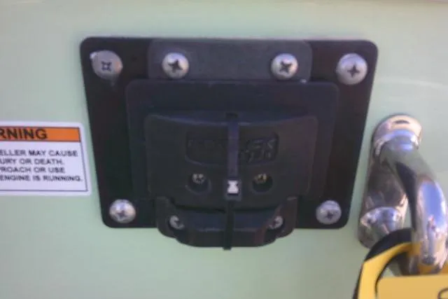 Slide: The Image of 2022 Sea Pro 259 Center Console boat detail with warning label and hardware. - 15