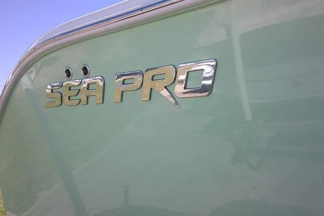 Slide: The Image of 2022 Sea Pro 259 Center Console boat logo on green hull. - 20