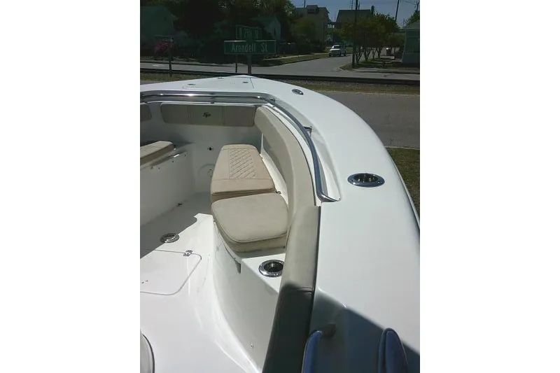 Slide: The Image of 2022 Sea Pro 259 Center Console boat interior with cushioned seating. - 23