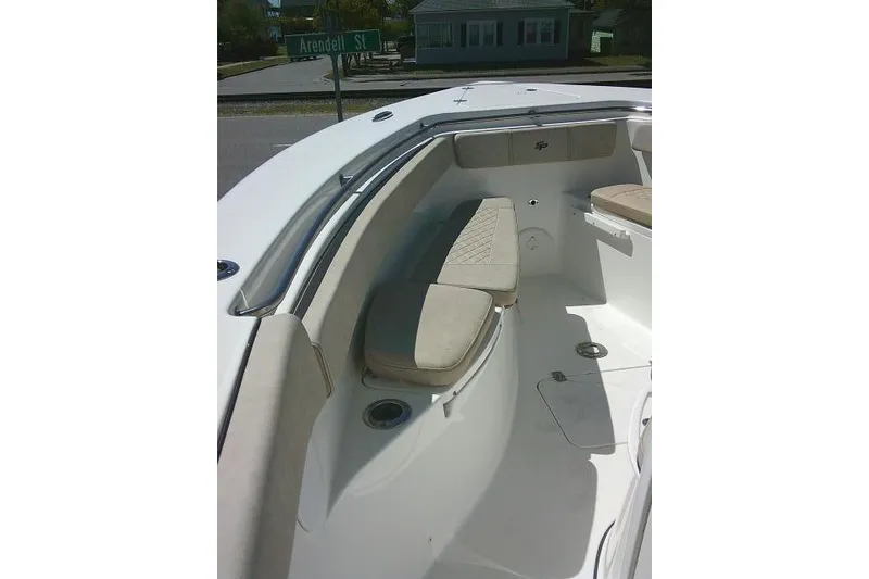 Slide: The Image of 2022 Sea Pro 259 Center Console boat interior with cushioned seating and stainless steel railings. - 25