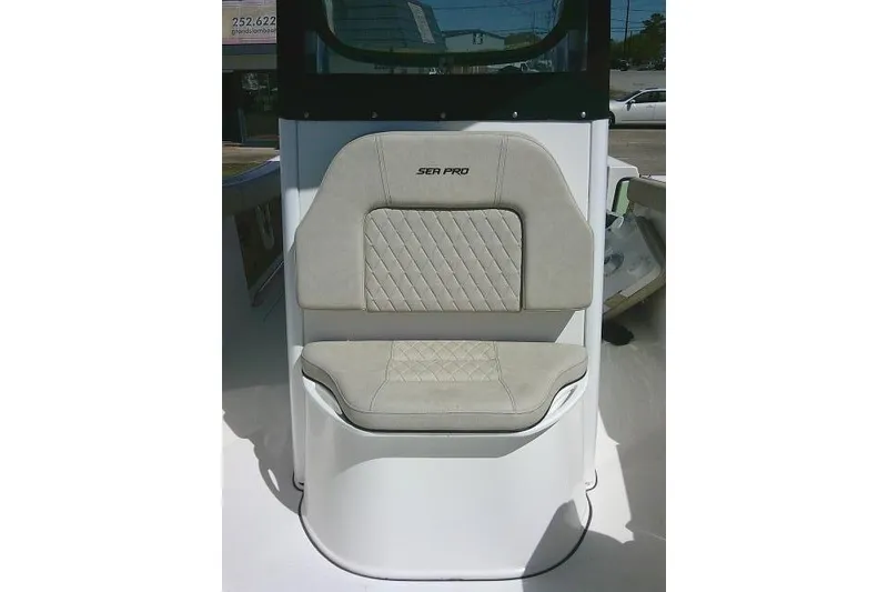 Slide: The Image of 2022 Sea Pro 259 Center Console boat seat with beige upholstery and diamond stitching. - 30