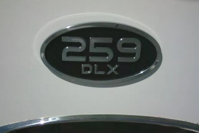 Slide: The Image of Sea Pro 259 DLX emblem on 2022 Center Console boat. - 35